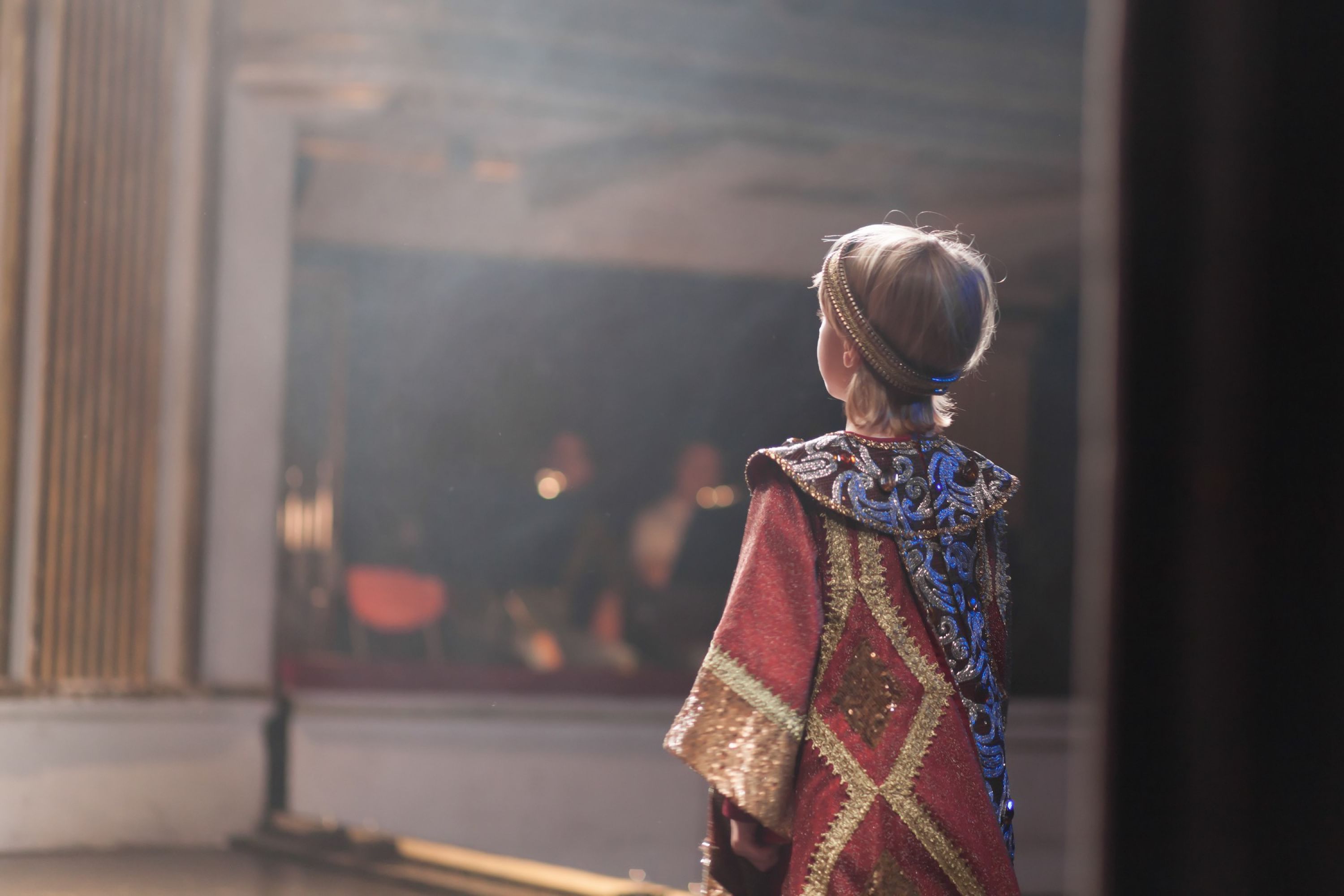 Image of young child in costume on a stage.