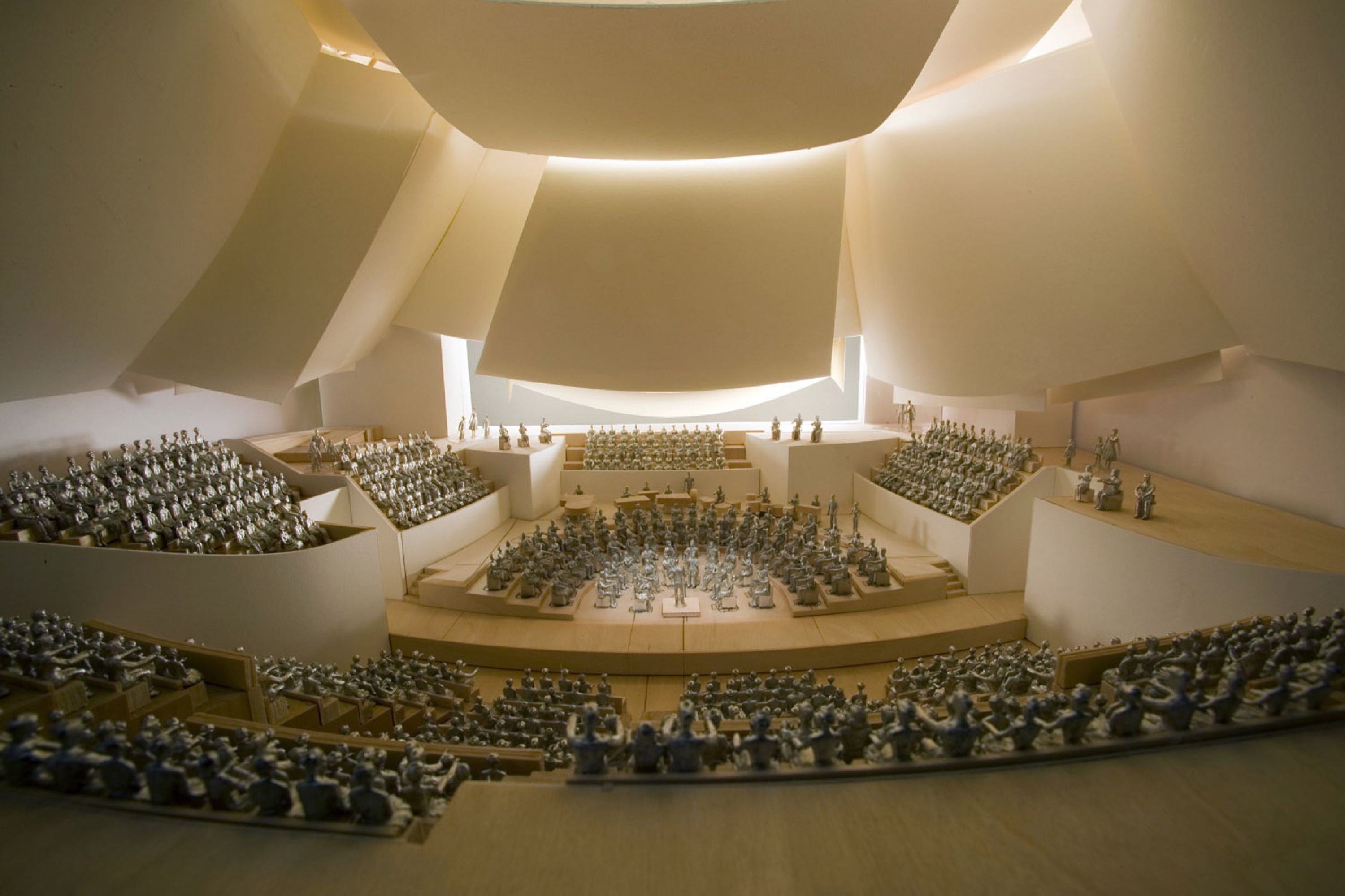 Image of brightly lit orchestra hall audience shot.