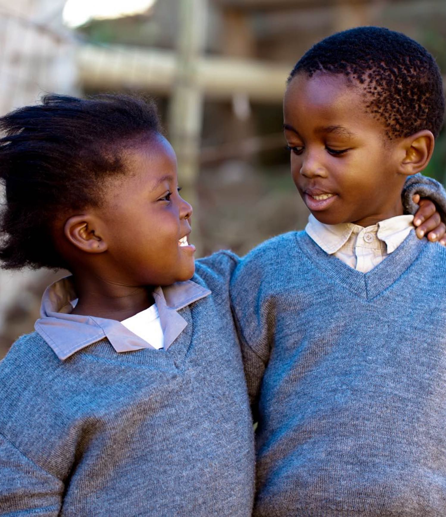 Image of two children hugging.