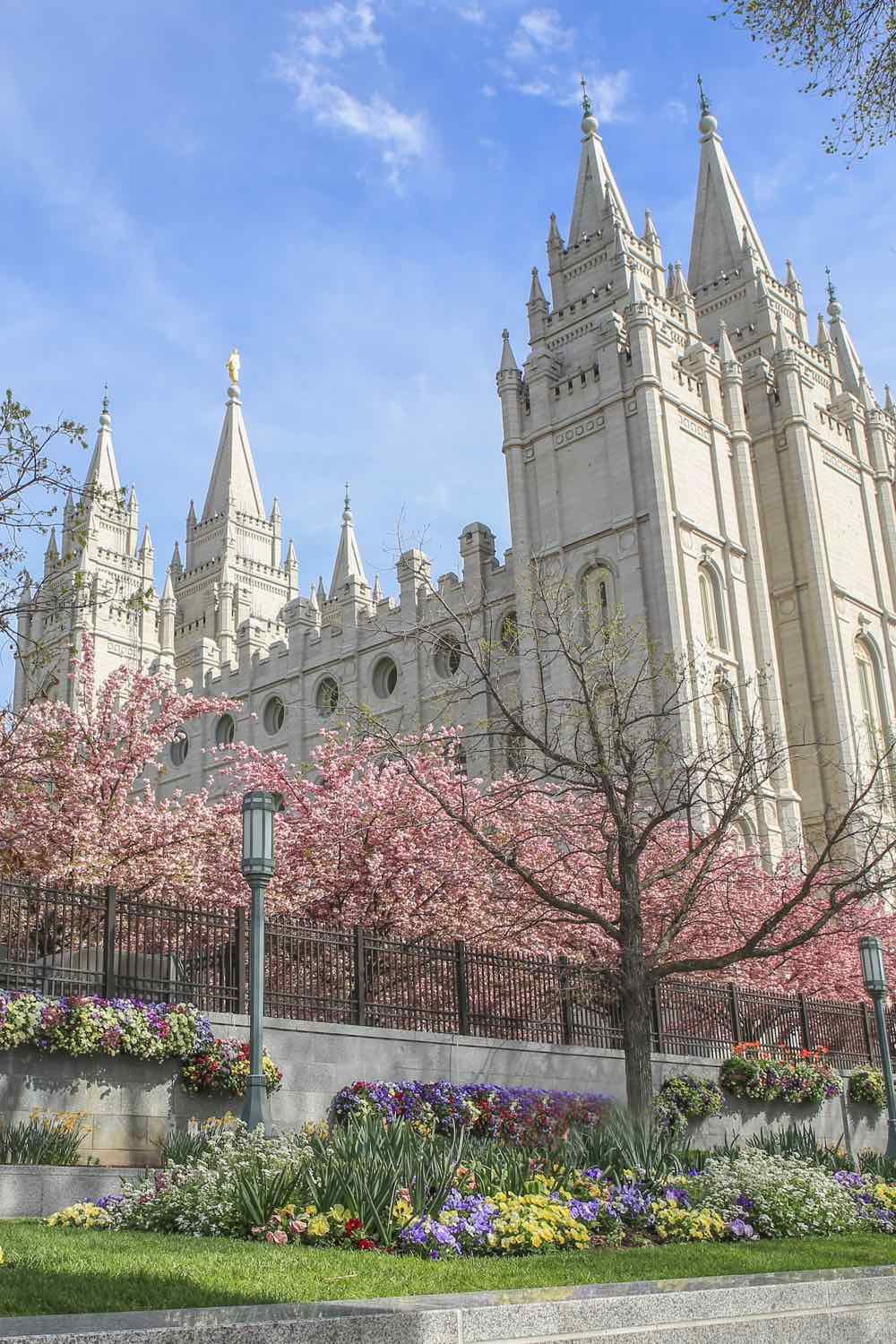 Image of a cathedral and gardens on a sunny blue sky day.