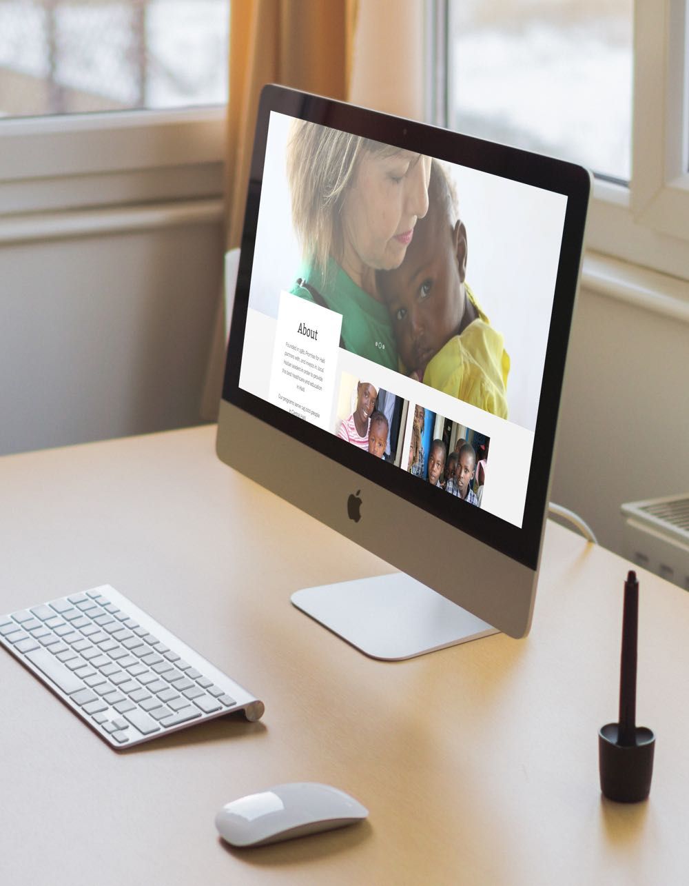 Computer on a desk with image of woman and child.