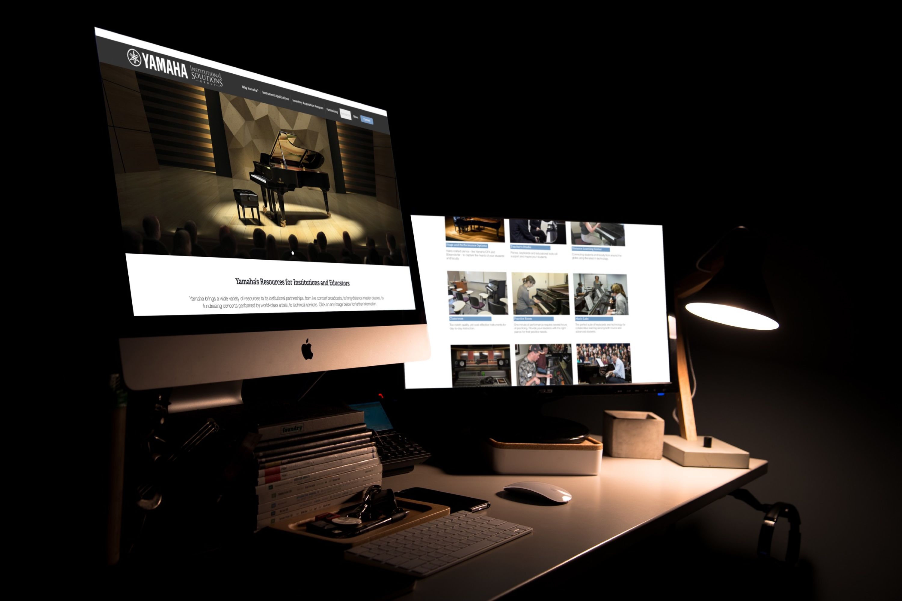 Image of desk with 2 desktop computers showing images of pianos.