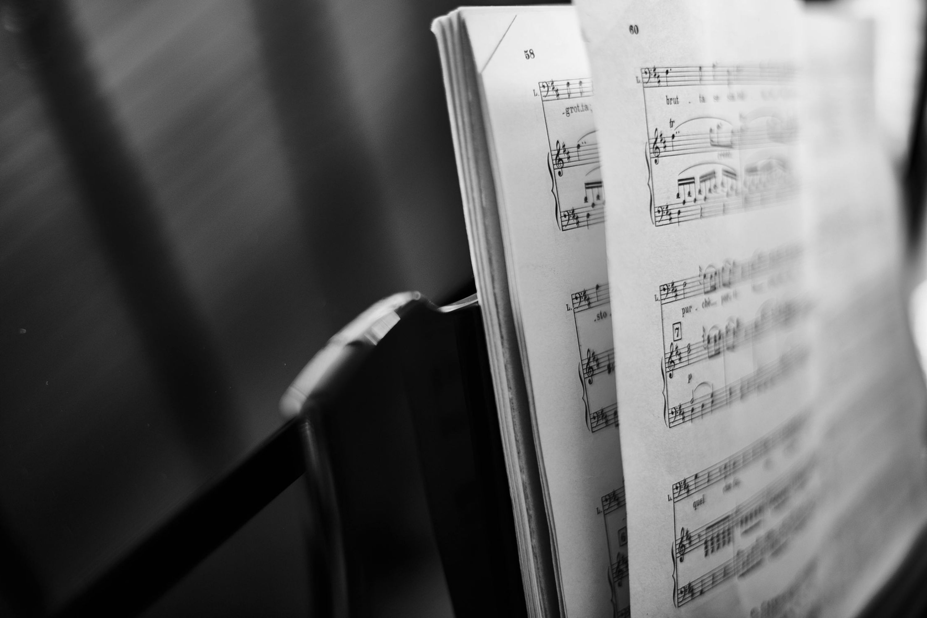 The left side of a musical notes book on a music stand.