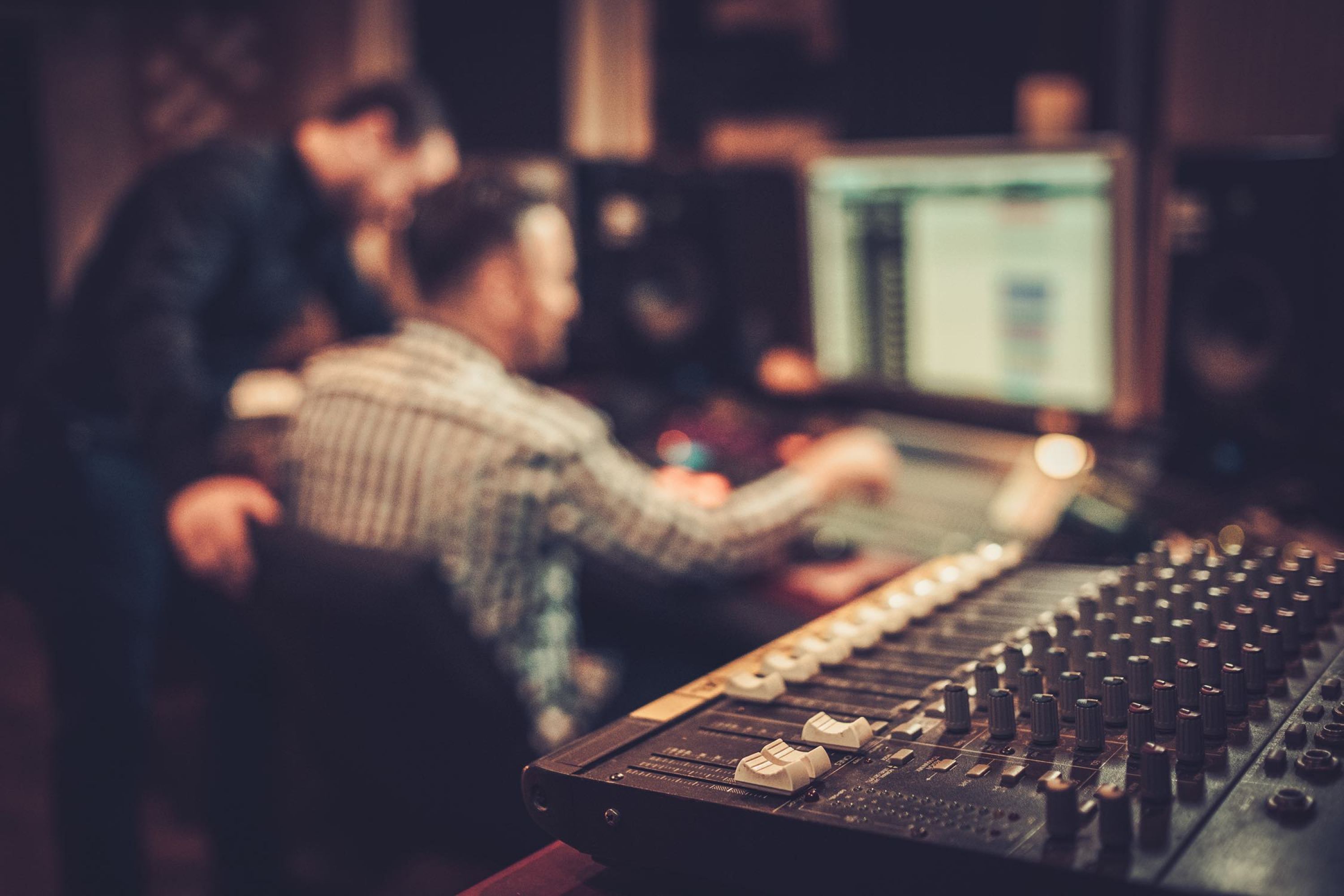 Two men in a sound studio.