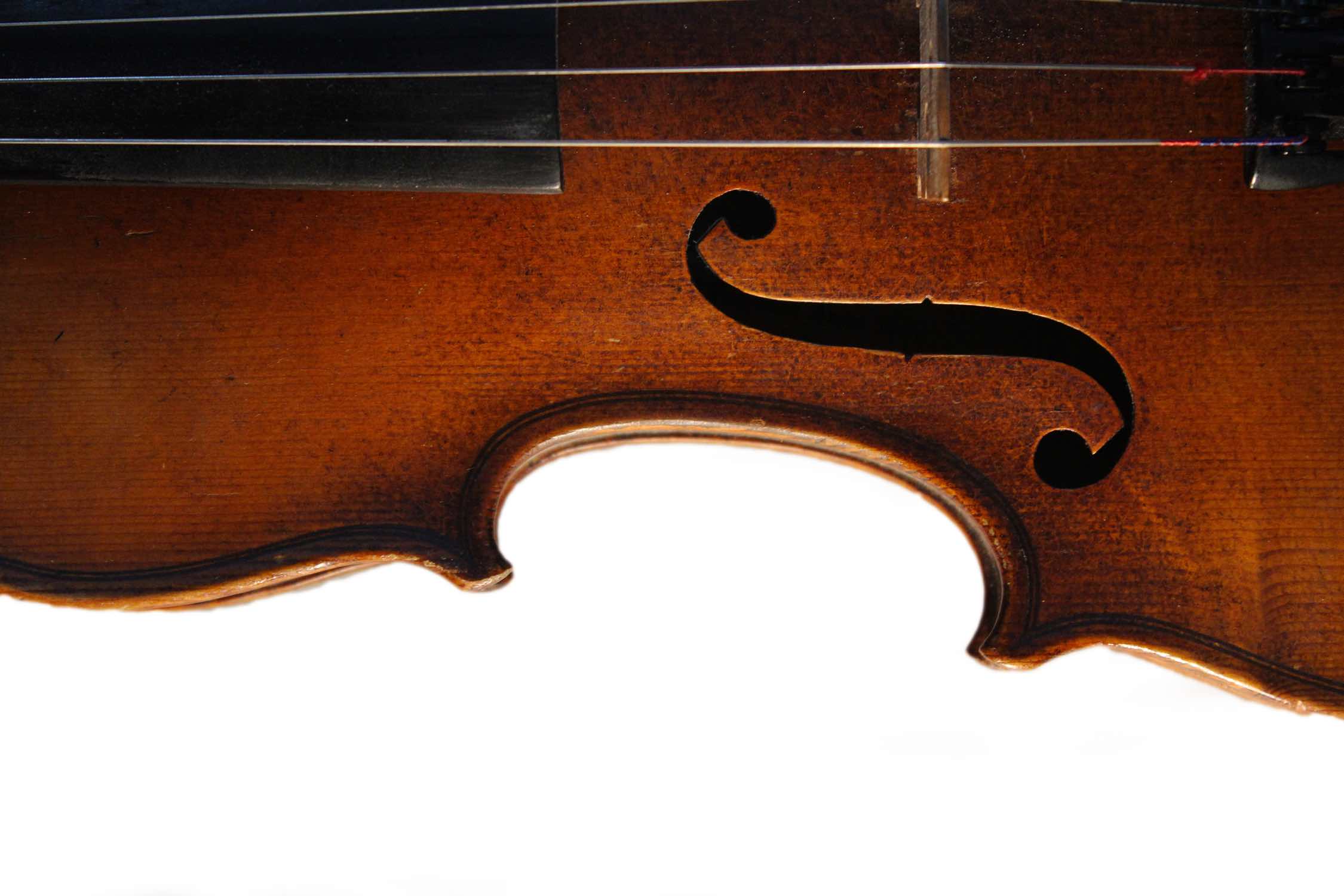 Image of 1/2 of a violin laying down.