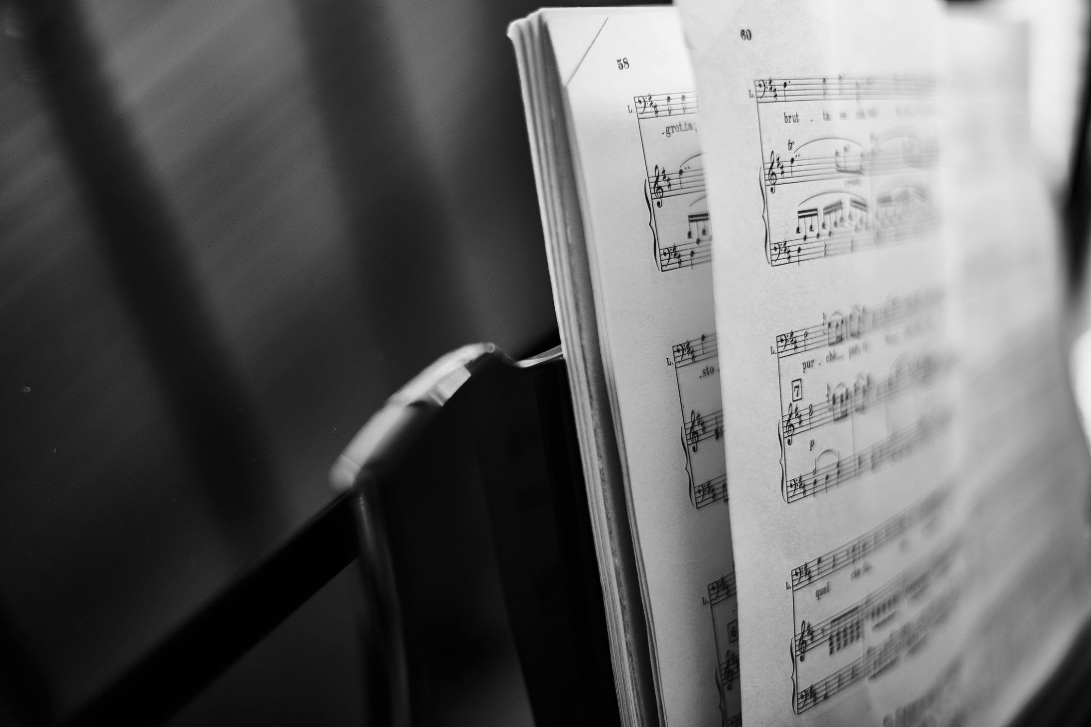 The left side of a musical notes book on a music stand.